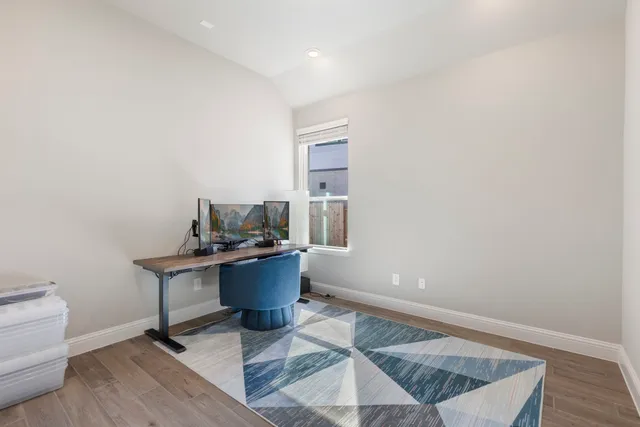 a workspace with furniture and wooden floor