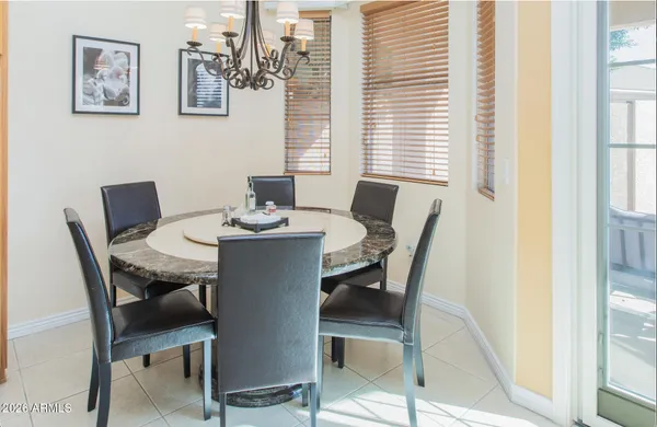 a view of a dining room with furniture and window