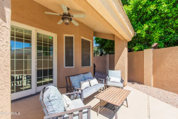 a outdoor space with patio the couches and a dining table with garden view