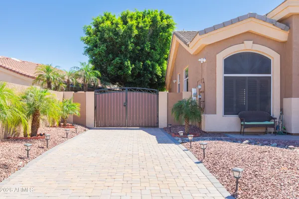 a view of a house with a backyard and a tub