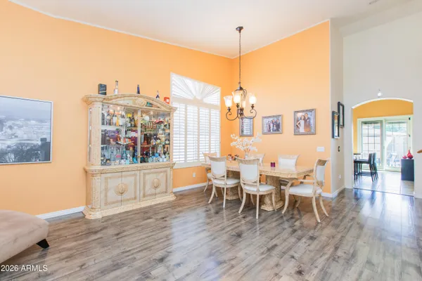 a view of a dining room with furniture and wooden floor