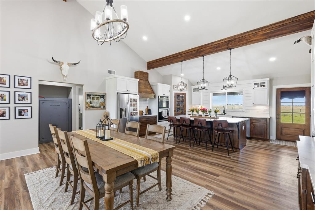 2201 South Road Whitesboro, TX 76273 - Photo 13 of 40 a view of a dining room with furniture window and wooden floor