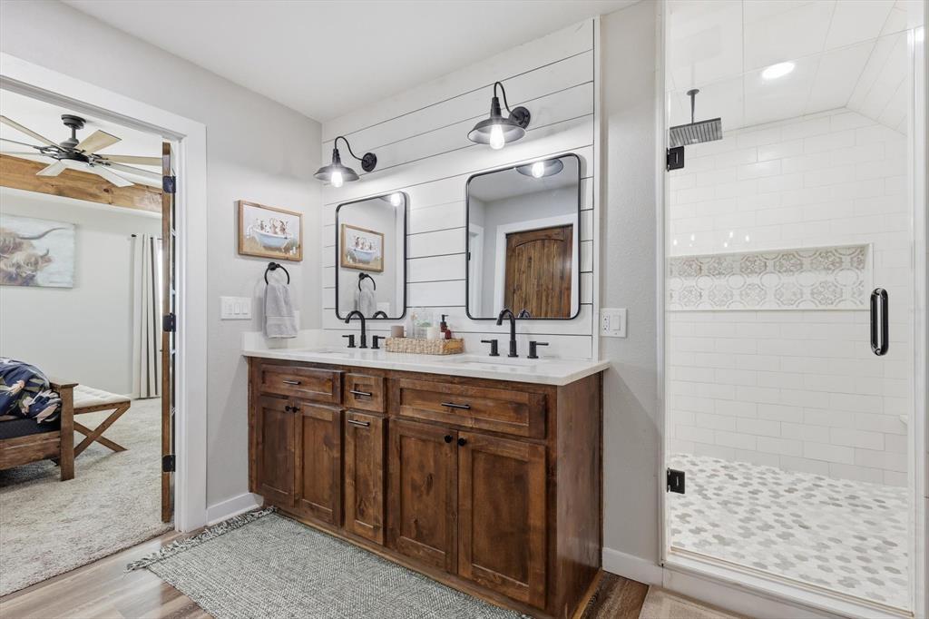 2201 South Road Whitesboro, TX 76273 - Photo 22 of 40 a spacious bathroom with a shower sink and mirror