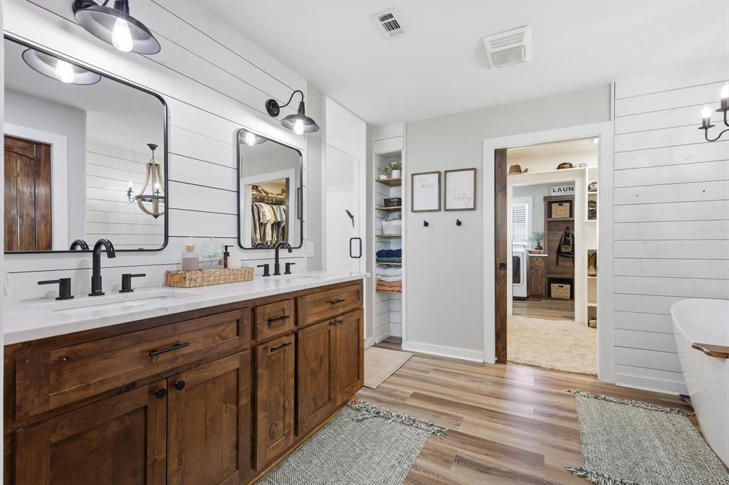 2201 South Road Whitesboro, TX 76273 - Photo 26 of 40 a spacious bathroom with a double vanity sink and a mirror
