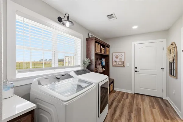 a kitchen that has a sink and a stove in it
