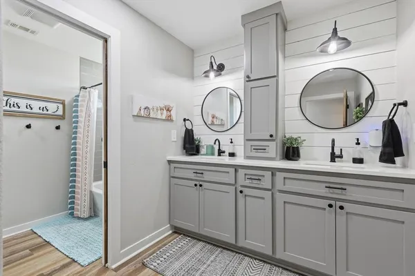 a bathroom with a sink and a mirror