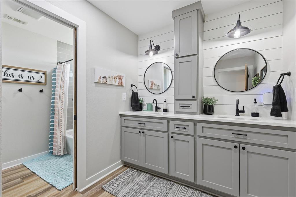 2201 South Road Whitesboro, TX 76273 - Photo 31 of 40 a bathroom with a sink and a mirror