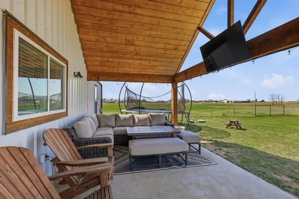 a outdoor living space with furniture and garden view