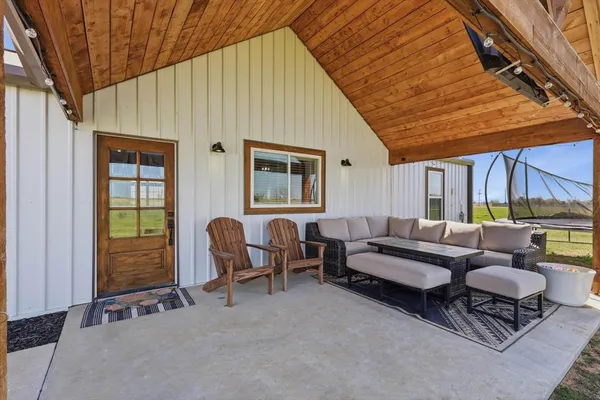 a outdoor space with patio the couches and a potted plant