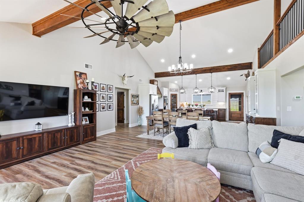 2201 South Road Whitesboro, TX 76273 - Photo 9 of 40 a living room with furniture and a flat screen tv