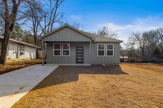 a front view of a house with yard