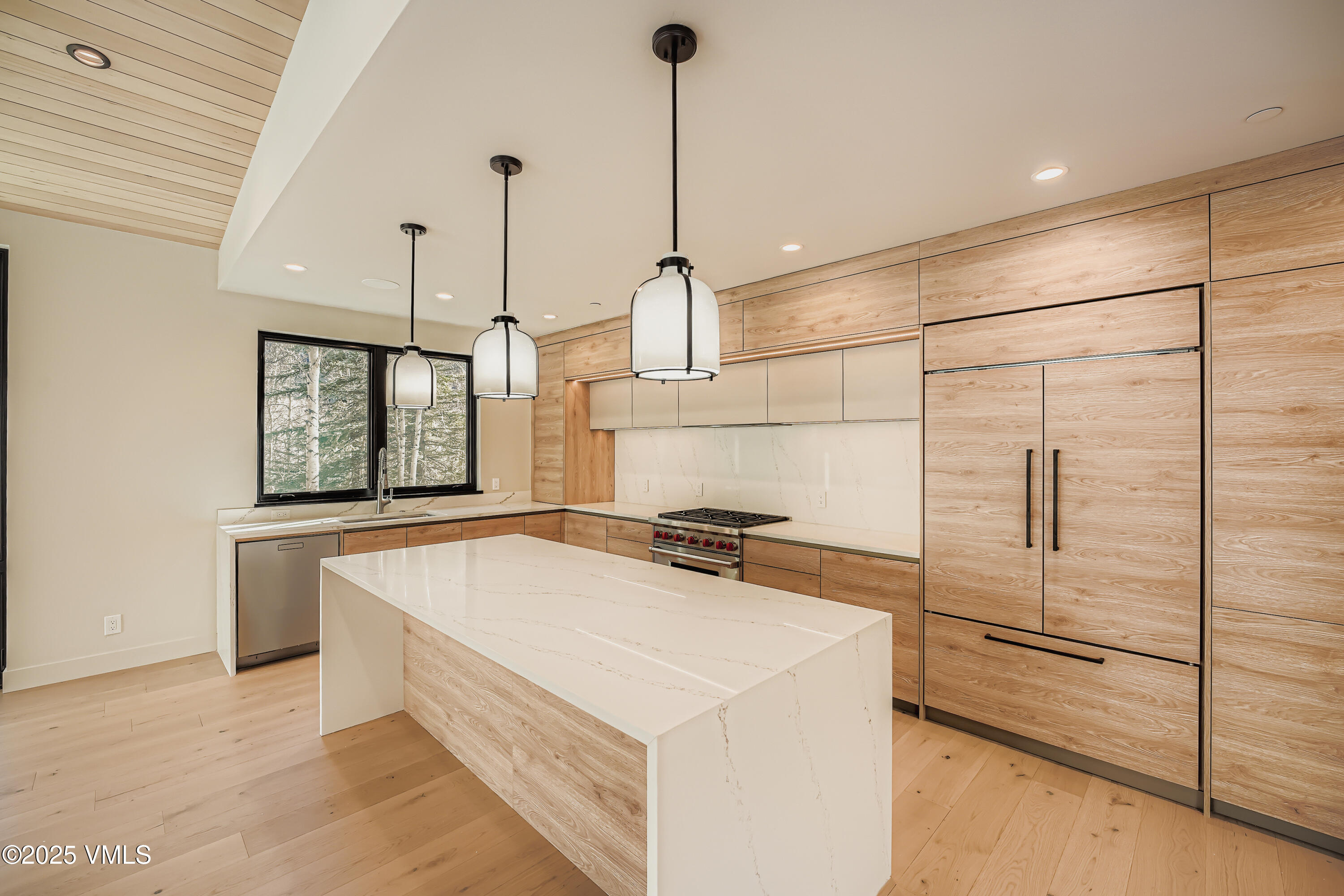 2811 Bald Mountain Road Vail, CO 81657 - Photo 15 of 55 a kitchen with a stove a refrigerator and ceiling fan