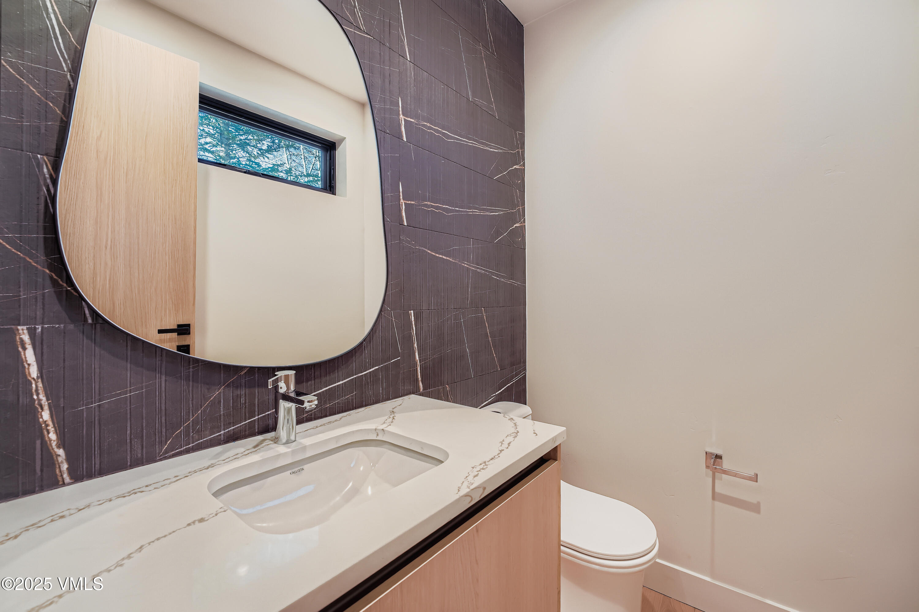 2811 Bald Mountain Road Vail, CO 81657 - Photo 21 of 55 a bathroom with a sink a toilet and mirror