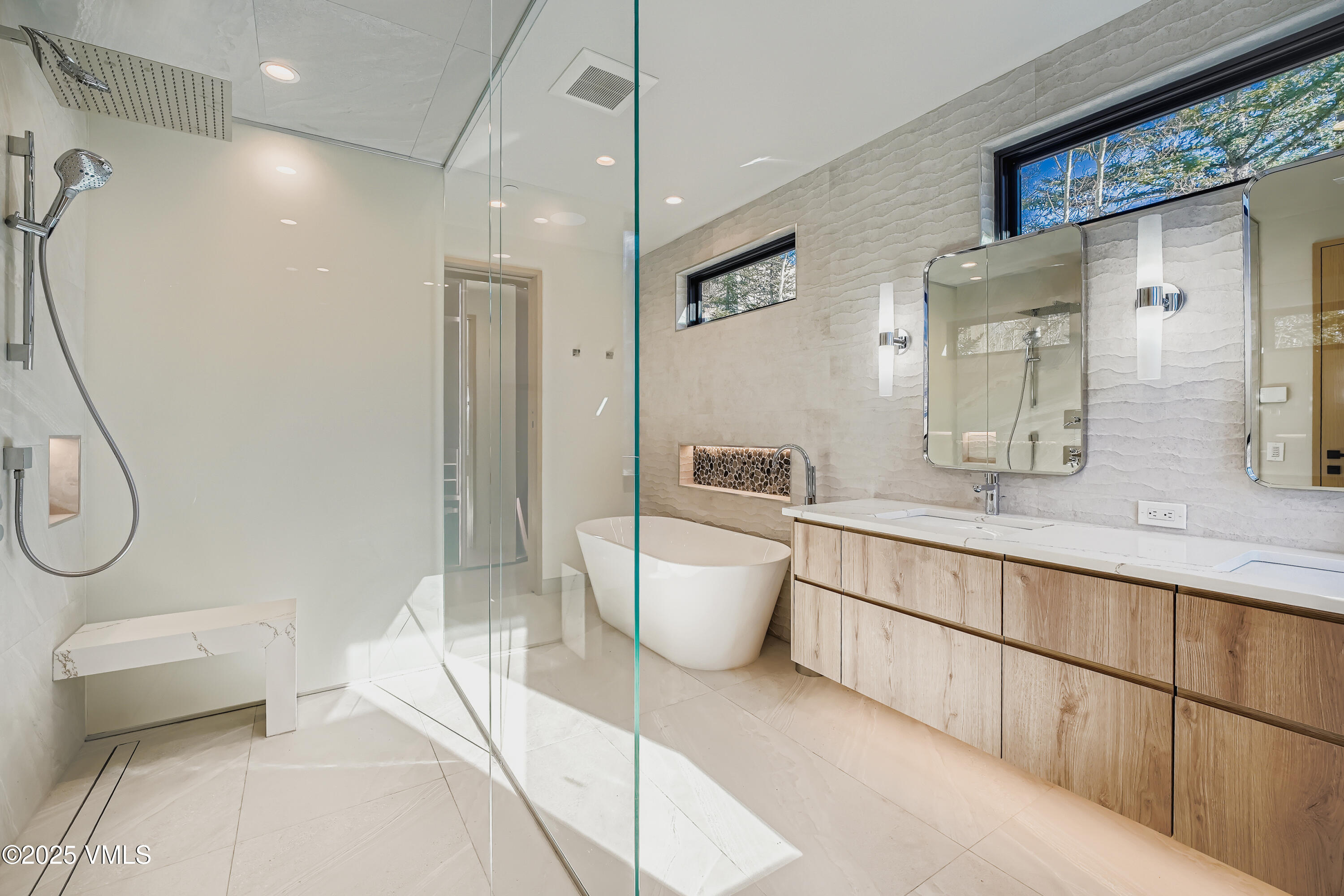 2811 Bald Mountain Road Vail, CO 81657 - Photo 27 of 55 a bathroom with a double vanity sink toilet and shower