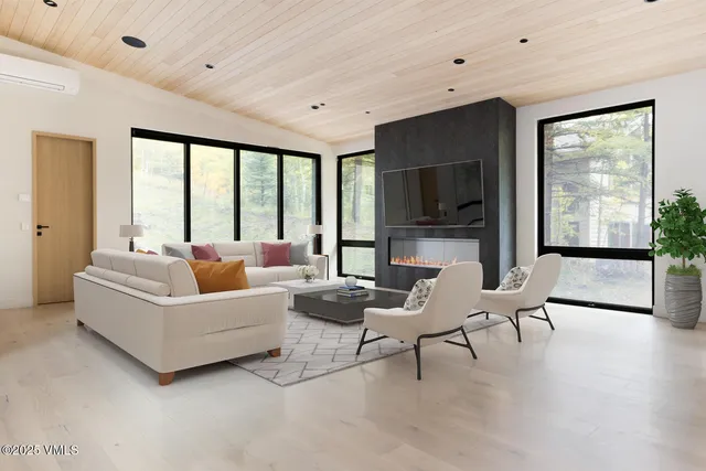 a kitchen with a stove a refrigerator and ceiling fan