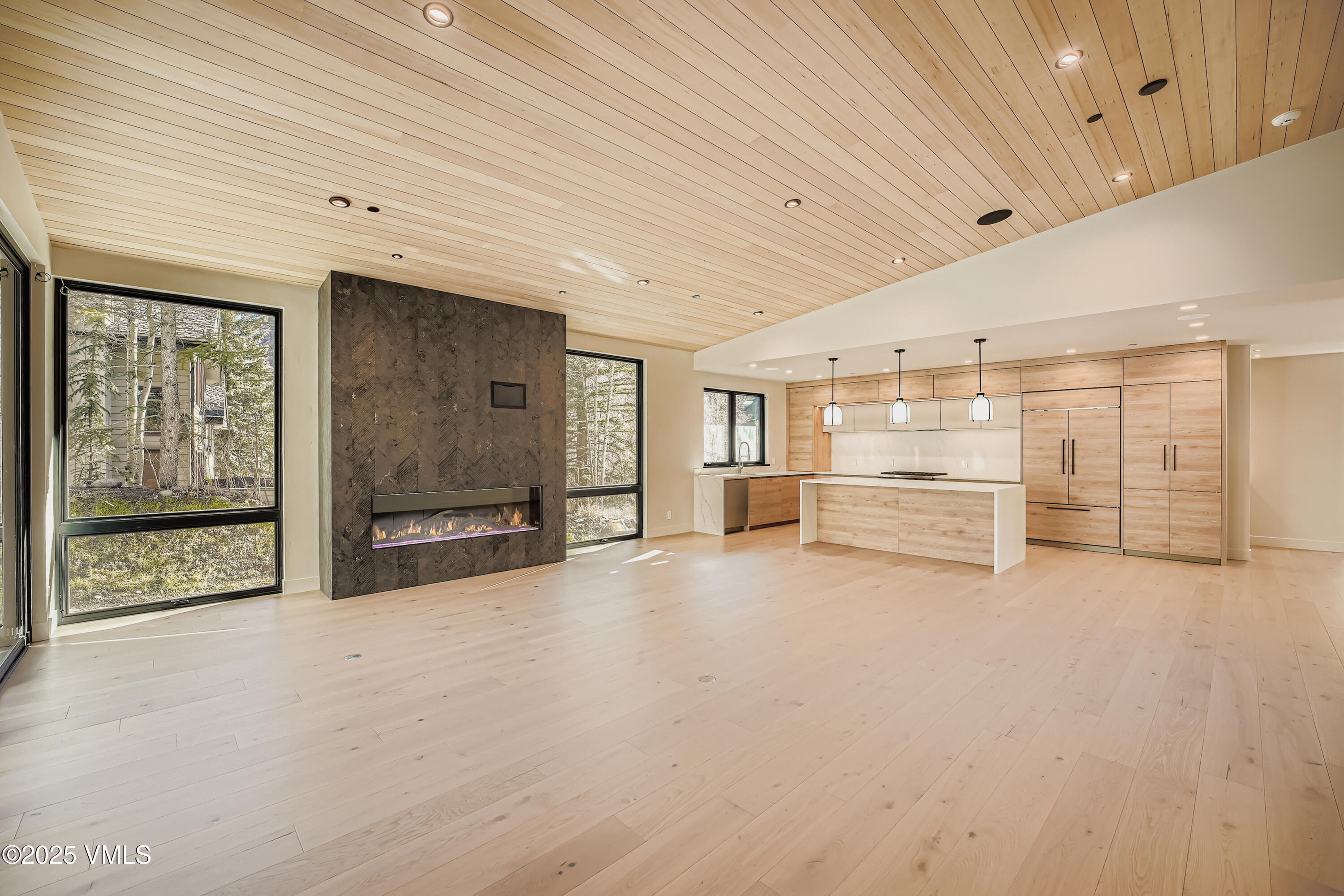 2811 Bald Mountain Road Vail, CO 81657 - Photo 8 of 55 a view of an empty room with large windows