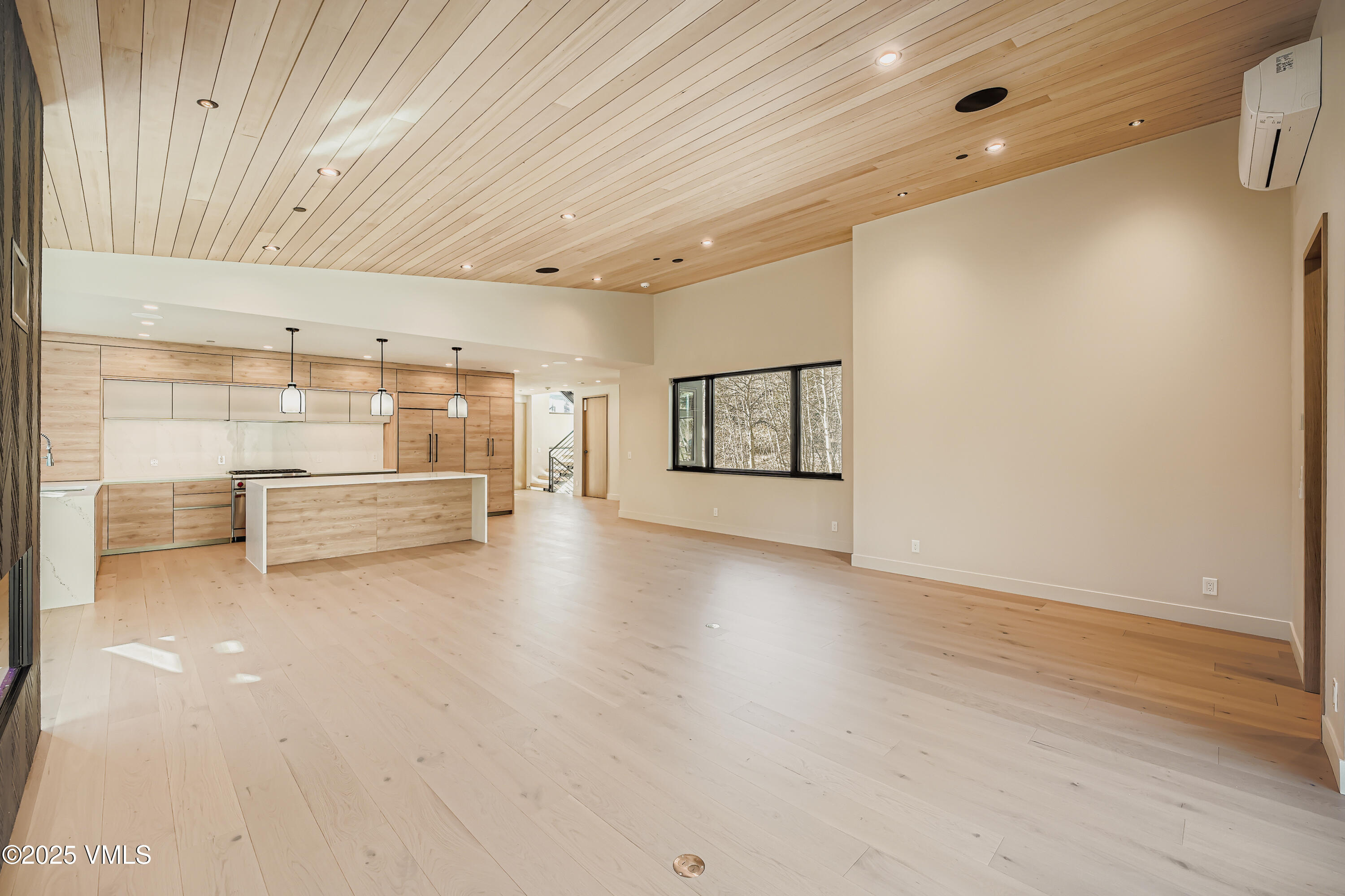 2811 Bald Mountain Road Vail, CO 81657 - Photo 9 of 55 a view of a livingroom with wooden floor and windows