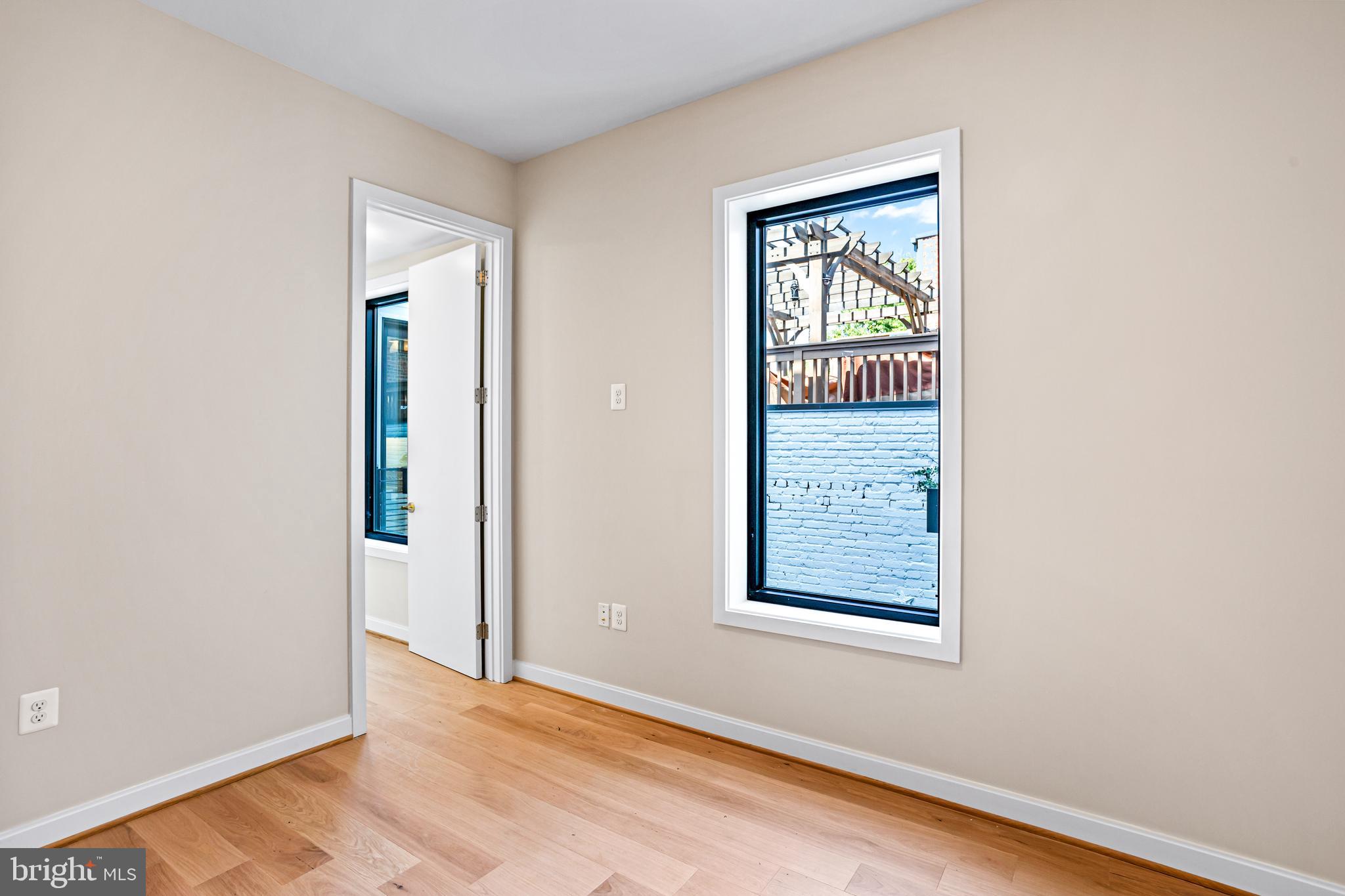 1402 12th Street Northwest, Unit 10 Washington, DC 20005 - Photo 20 of 38 an empty room with windows and closet