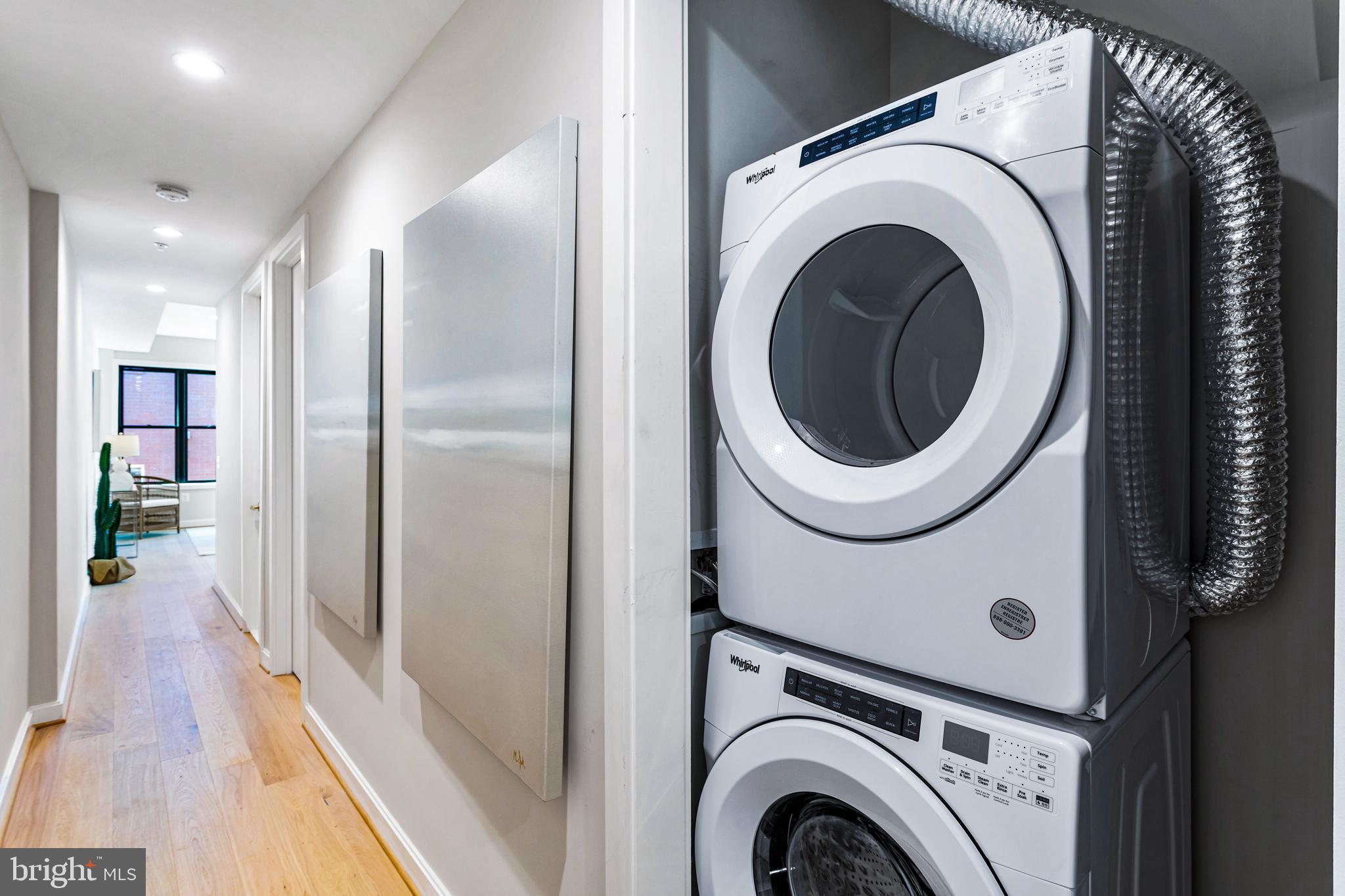 1402 12th Street Northwest, Unit 10 Washington, DC 20005 - Photo 24 of 38 a view of entryway with washer and dryer