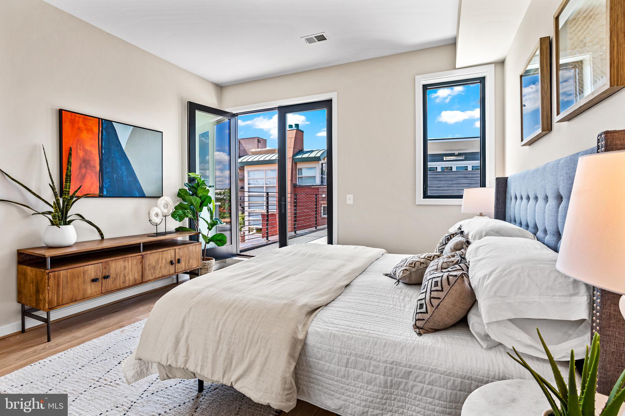1402 12th Street Northwest, Unit 10 Washington, DC 20005 - Photo 27 of 38 a spacious bedroom with a bed and window
