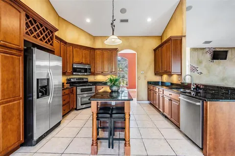 a view of a livingroom with furniture and a flat screen tv