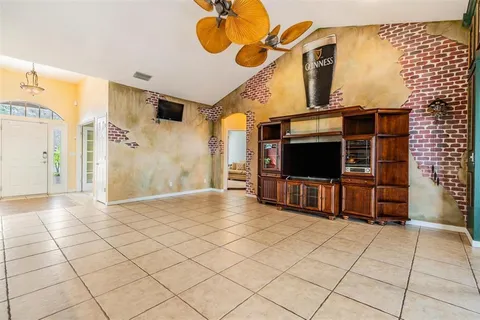 a spacious bedroom with a bed and a window