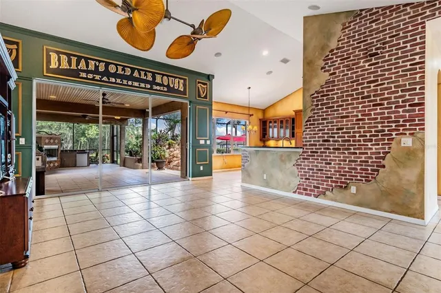 a spacious bedroom with a bed and a ceiling fan