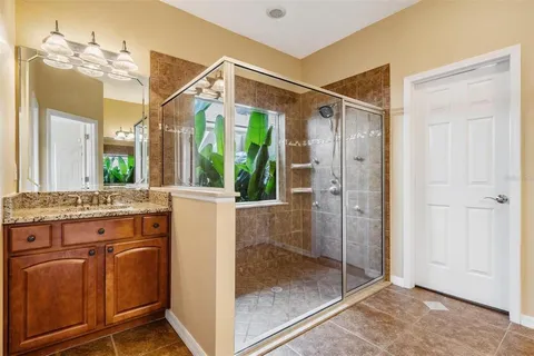 a view of a garden with a building in the background