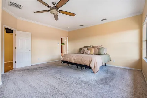 a view of staircase with a large window and wooden floor