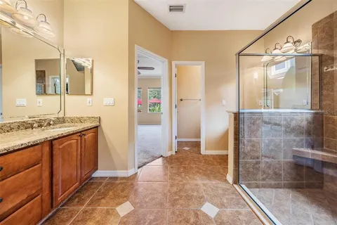 a kitchen with stainless steel appliances granite countertop a stove and a refrigerator