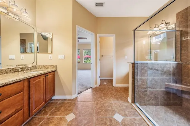 a kitchen with stainless steel appliances granite countertop a stove and a refrigerator