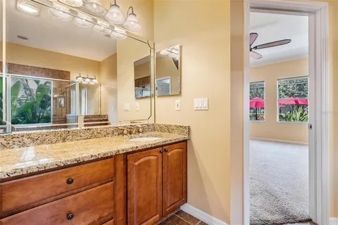 a view of a livingroom with furniture flat screen tv and wooden floor