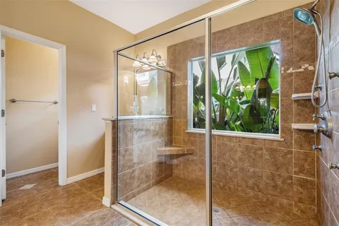 a view of a garden with a building in the background