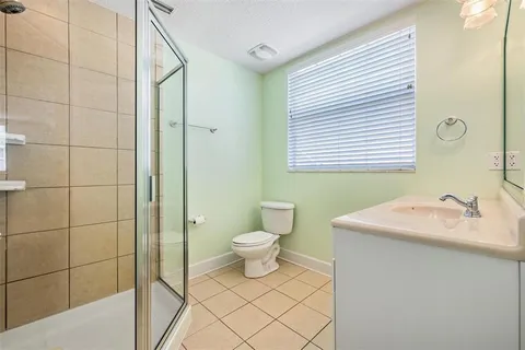 a backyard of a house with yard and outdoor seating