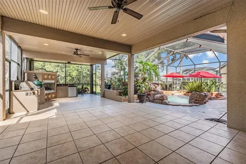 a view of a backyard with sitting area
