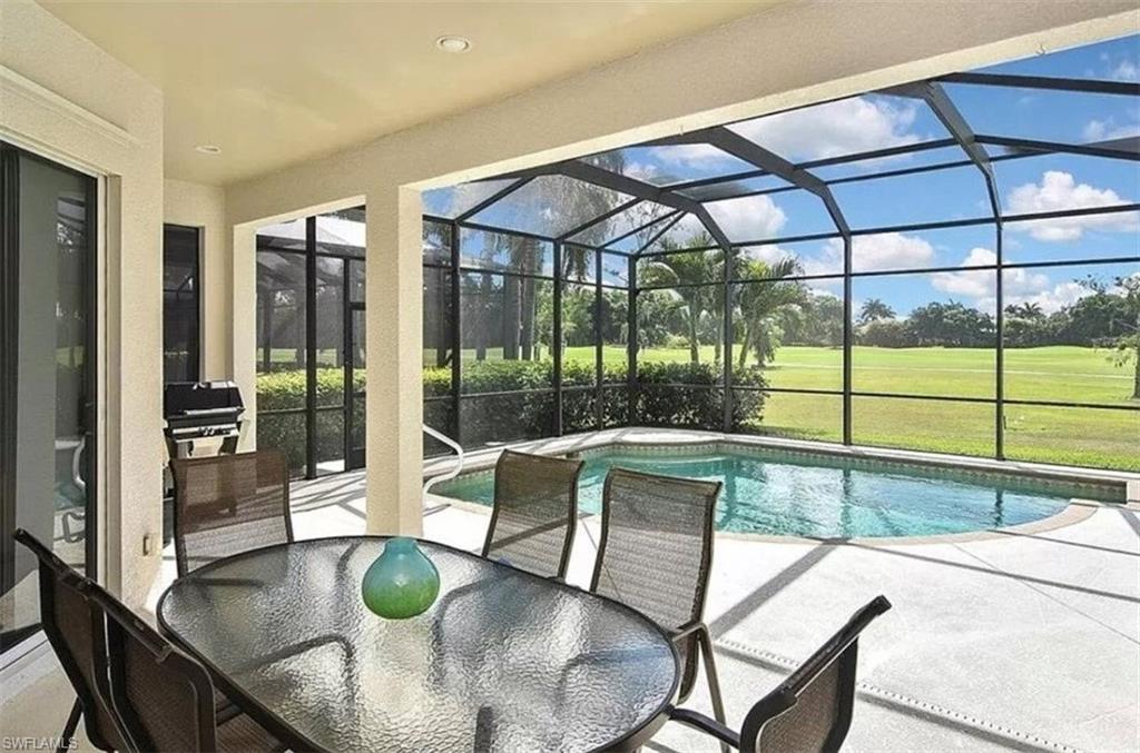 6044 Dogleg Drive Naples, FL 34113 - Photo 2 of 21 a view of a dining room with furniture wooden floor and next to windows