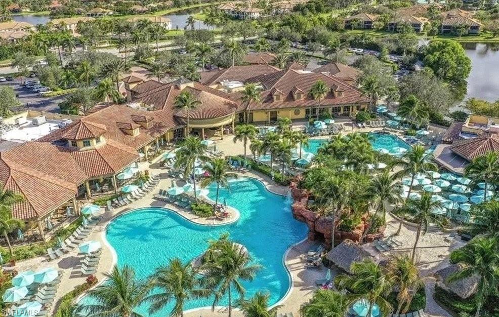 6044 Dogleg Drive Naples, FL 34113 - Photo 21 of 21 an aerial view of residential houses with outdoor space and trees
