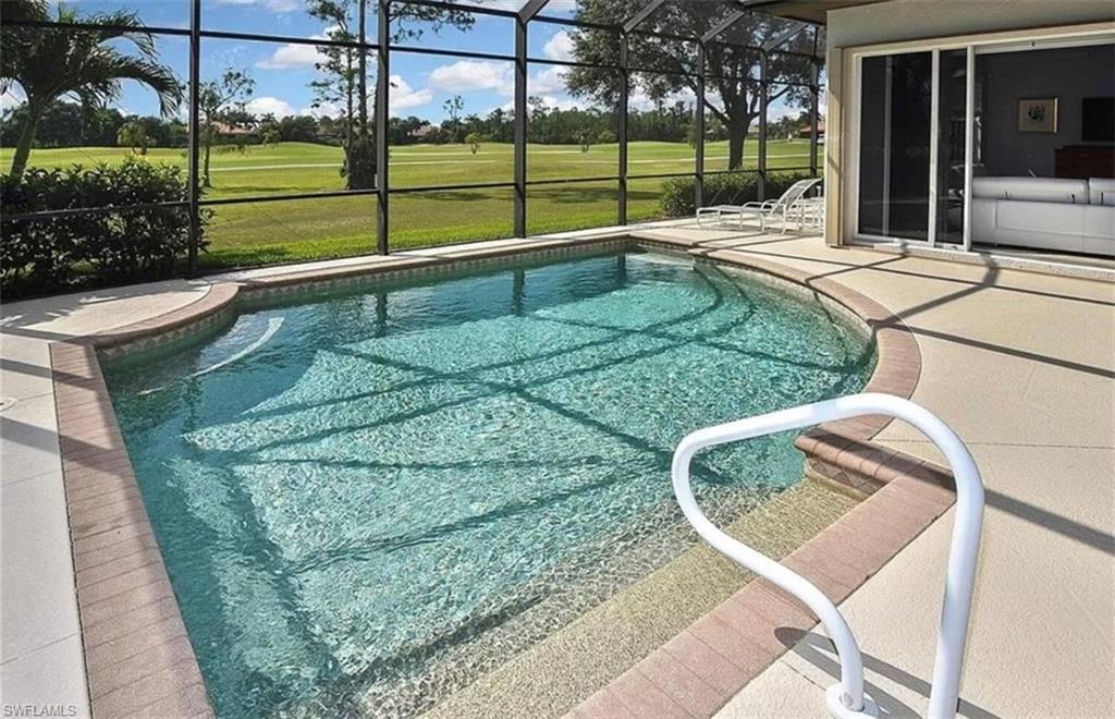 6044 Dogleg Drive Naples, FL 34113 - Photo 3 of 21 a view of a house with a backyard