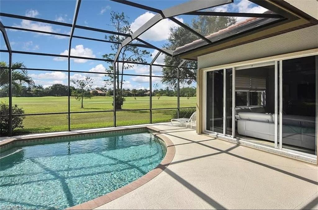 6044 Dogleg Drive Naples, FL 34113 - Photo 4 of 21 a view of a backyard