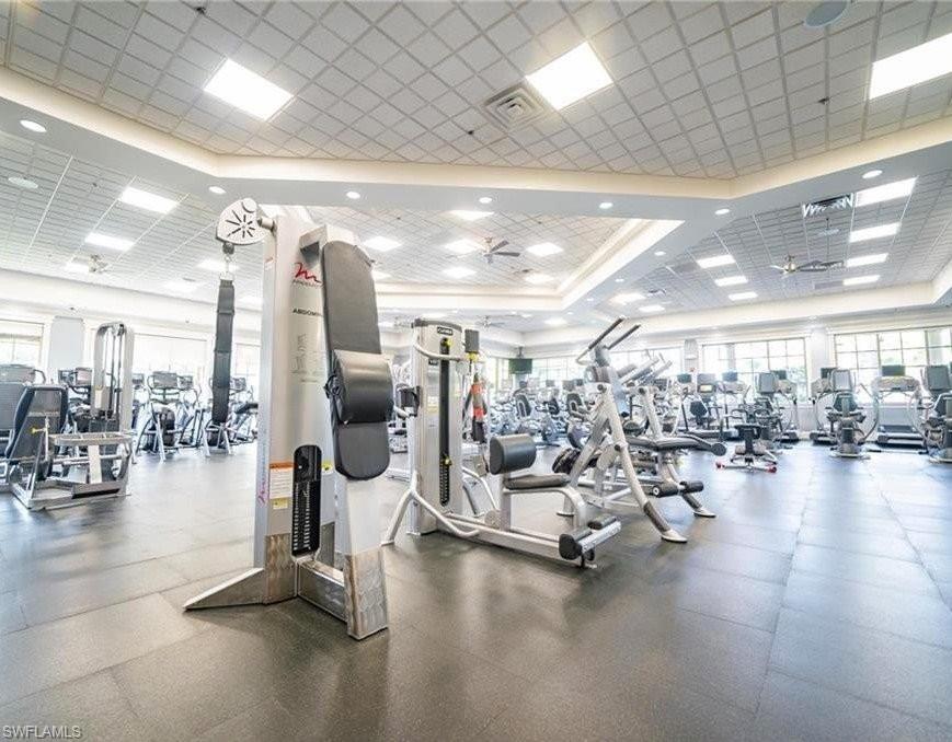 6044 Dogleg Drive Naples, FL 34113 - Photo 9 of 21 a view of a room with gym equipment