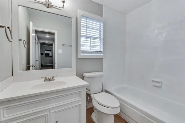 a bathroom with a sink toilet and bathtub