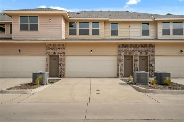 a front view of a house with parking
