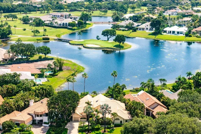 an aerial view of a house with a swimming pool yard and outdoor seating