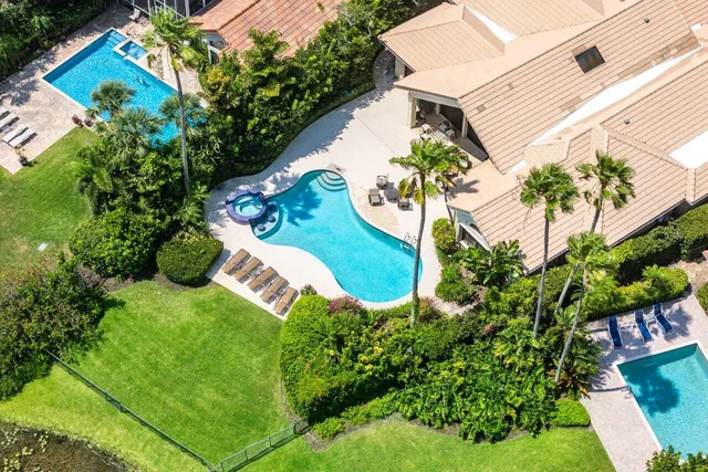 a view of a lake with houses in the back