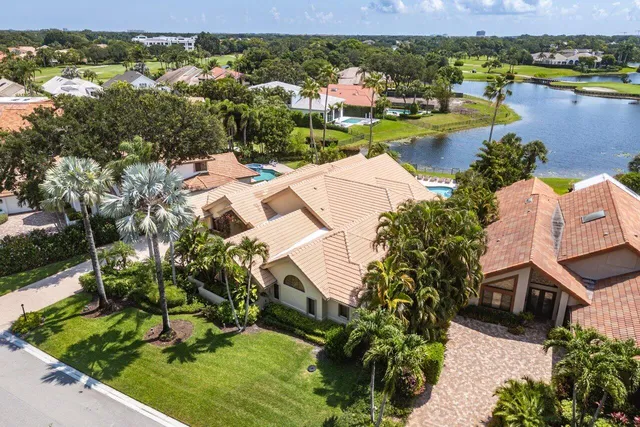 a view of a garden with a building in the background