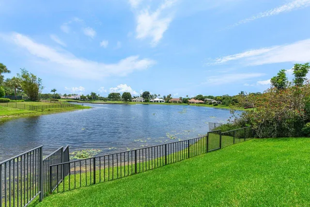 a swimming pool with outdoor seating and yard