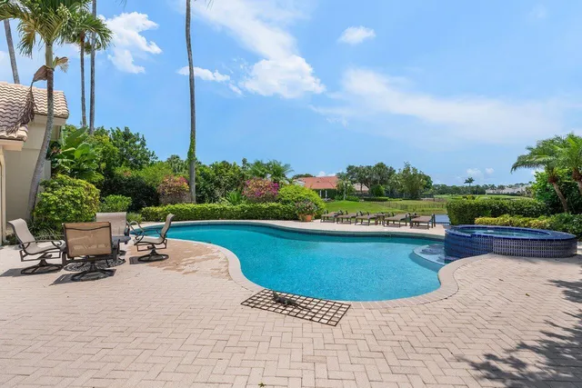 a view of a lake with houses in the background