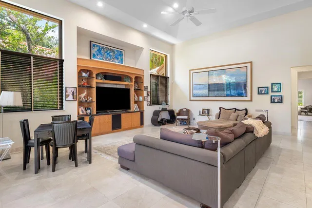 a spacious bathroom with a double vanity sink large mirror and a bathtub