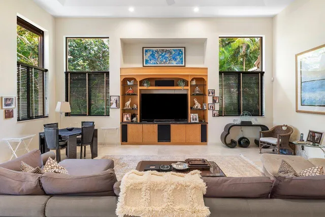 a bathroom with a double vanity sink and mirror with shower