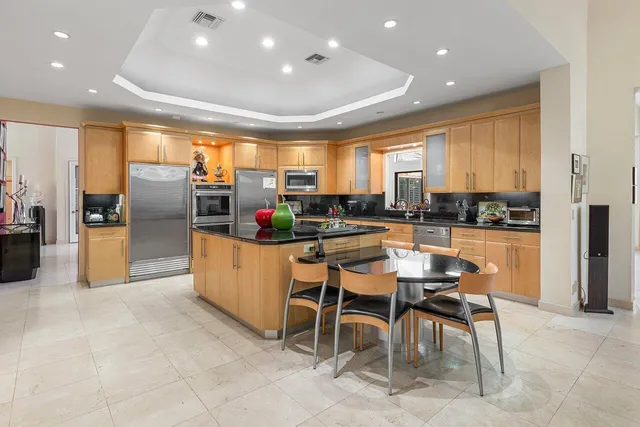 a bathroom with a shower sink and mirror